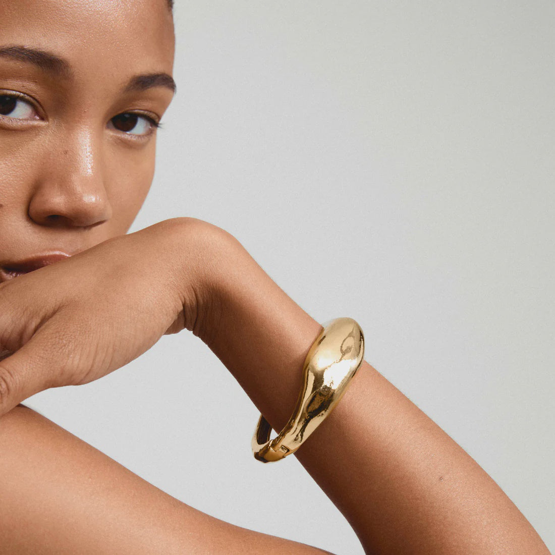pilgrim, gold bangle bracelet, chunky gold bangle, gold statement bracelet, gold plated bangle, women's gold bracelet, sculptural gold bracelet, gold cuff bracelet, modern gold jewelry, chunky gold bracelet, gold fashion bracelet, statement gold jewelry, gold plated jewelry, organic gold bangle, contemporary gold bracelet