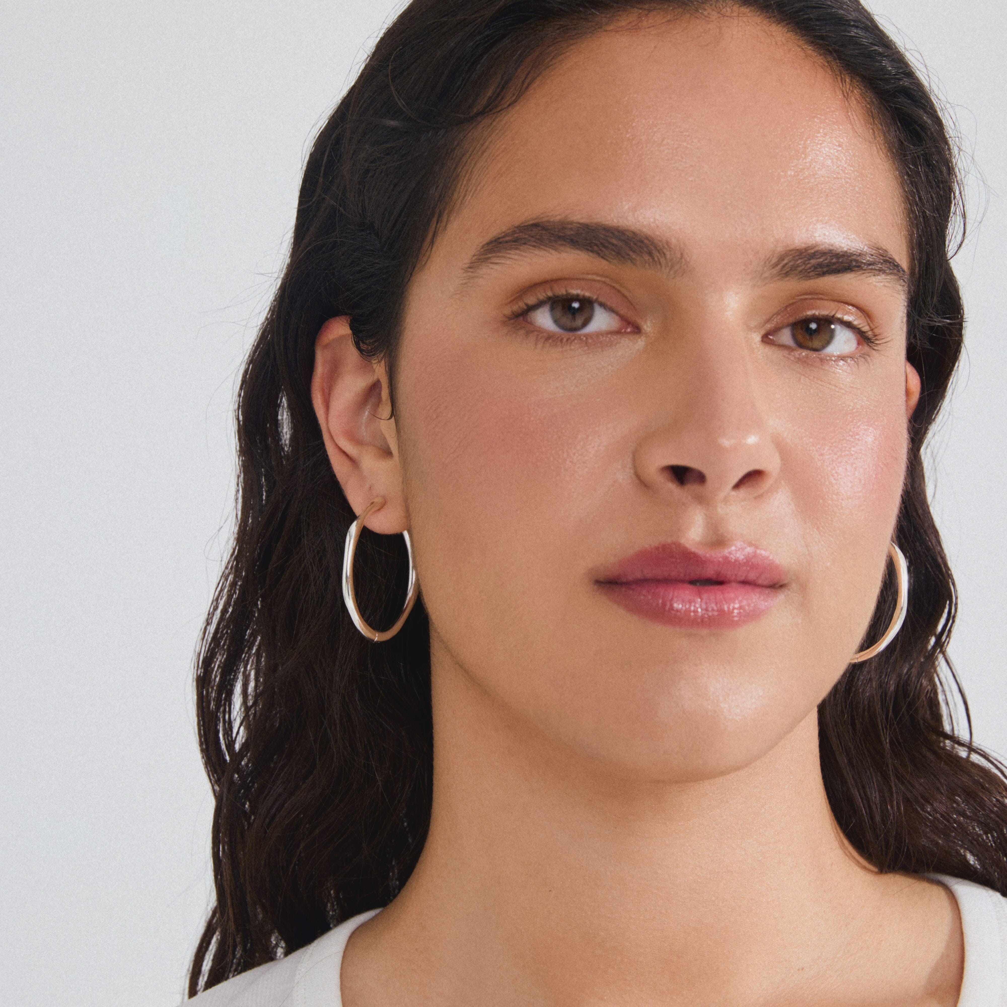 PILGRIM, PILGRIM EARRINGS, silver plated hoop earrings, silver oval hoop earrings, modern silver hoops, womens silver plated jewelry, minimalist hoop earrings, chunky silver hoops, everyday silver earrings, trendy silver hoop earrings, polished silver earrings, silver fashion jewelry, sculptural hoop earrings, lightweight silver hoops, silver statement earrings, chic silver jewelry