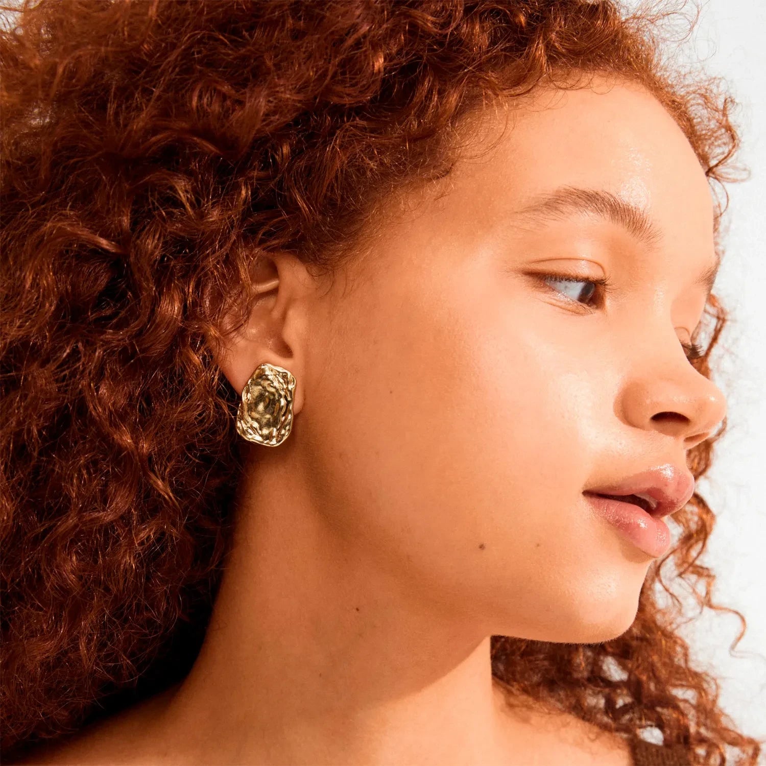 PILGRIM, gold stud earrings, gold statement earrings, gold plated studs, textured gold earrings, sculptural gold earrings, women's gold earrings, modern gold jewelry, gold fashion earrings, statement stud earrings, gold plated jewelry, contemporary gold earrings, organic shape earrings, trendy gold earrings
