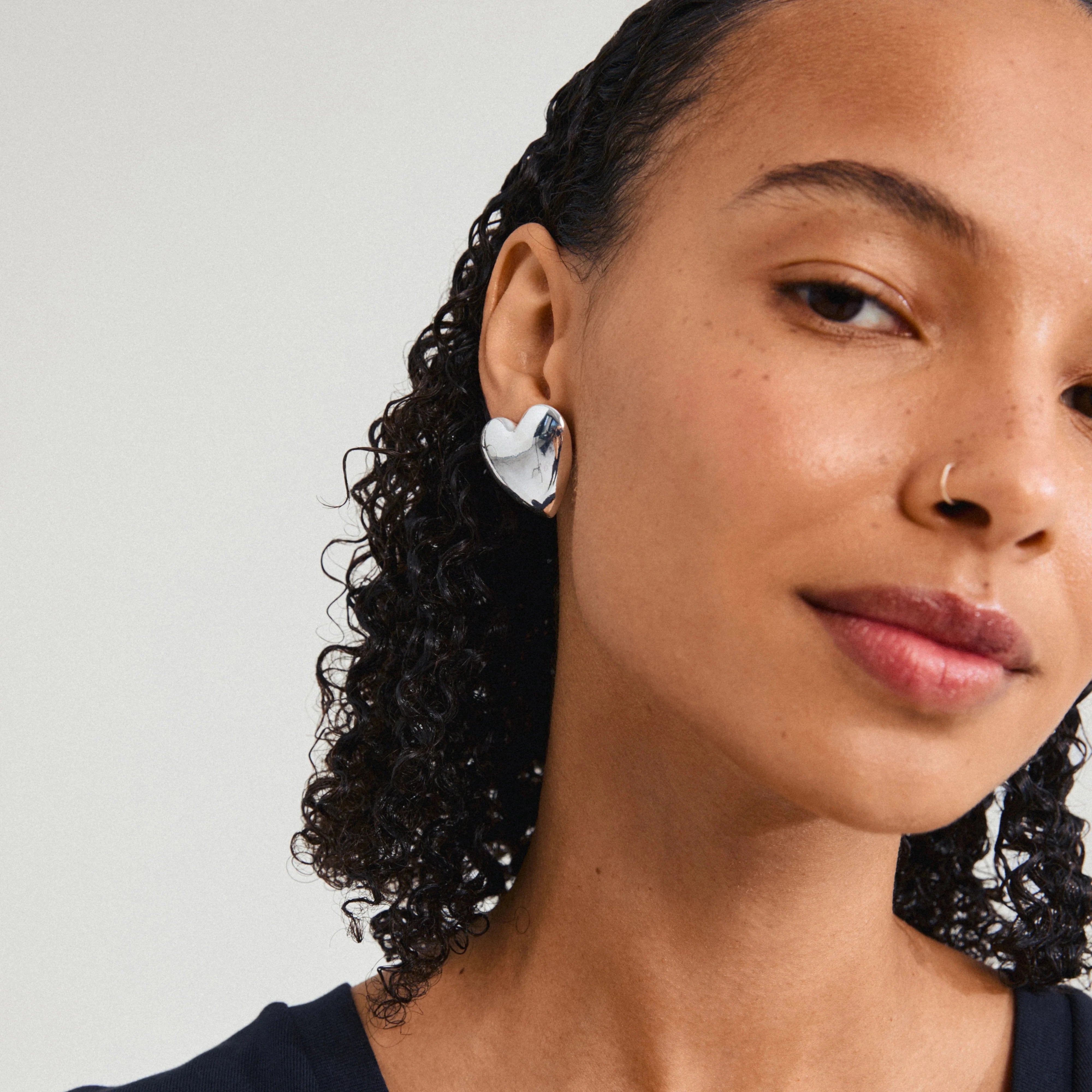 silver plated statement earrings, sculpted heart jewelry