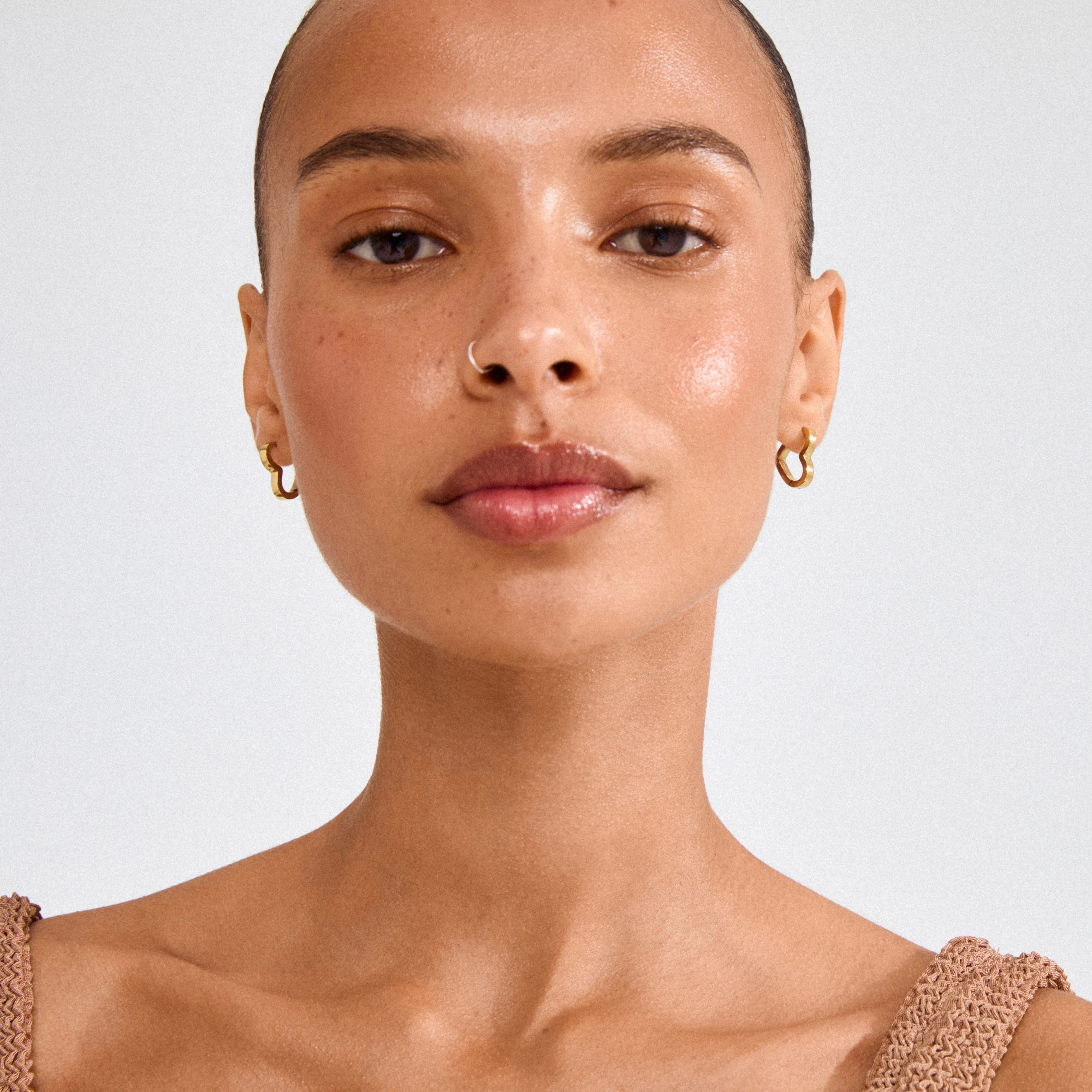 chunky gold hoop earrings, sculptural hoop earrings, gold heart jewelry, trendy womens accessories