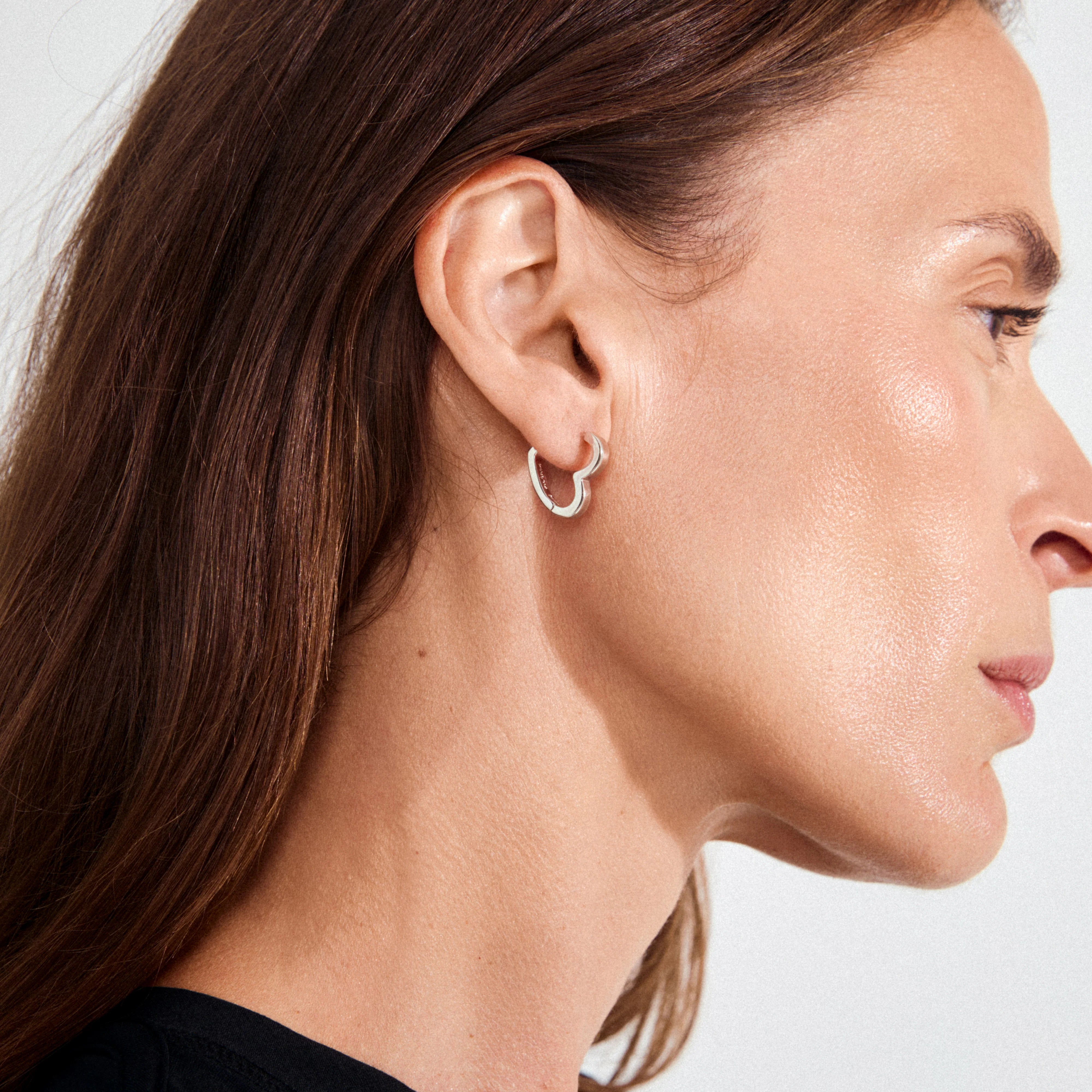 minimalist silver hoops, silver plated jewelry, modern heart earrings, everyday silver earrings, stylish silver hoops, fashion earrings for women