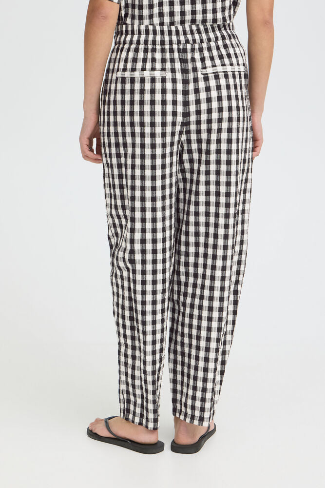 relaxed fit trousers women, black and white check pants, fashion forward pants women, women's vacation outfits, gingham clothing women, lightweight summer trousers, women's casual fashion, trendy barrel leg pants, gingham wide leg pants