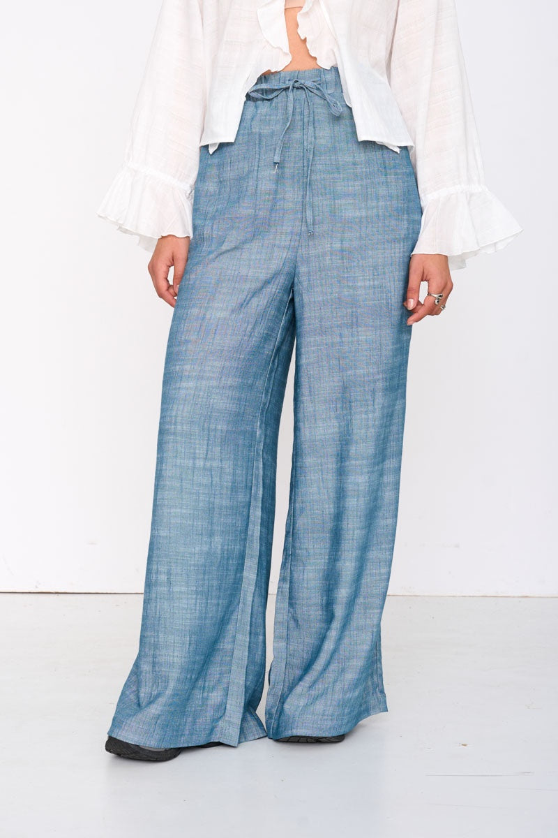 24clothing, chambray palazzo pants, blue wide leg pants, lightweight summer pants, women’s palazzo trousers, flowy blue pants, coastal style clothing, vacation outfit women, relaxed fit pants, chambray wide leg trousers, effortless summer fashion, women’s resort wear, breathable summer pants, elastic waist palazzo pants, casual chic outfit, everyday summer staples, relaxed coastal fashion