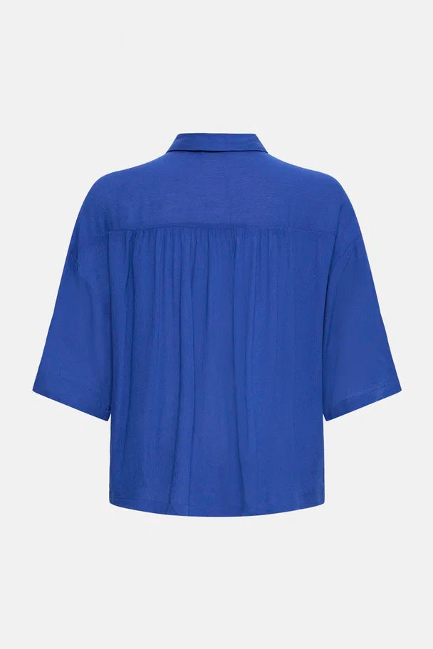 simple navy blouse outfit, flowy navy top women, work to weekend blouse navy, short sleeve navy button shirt, modern relaxed blouse women, navy summer blouse women, effortless navy outfit top, basic navy button blouse, versatile navy shirt women