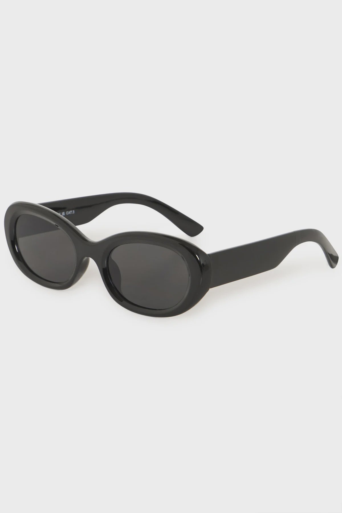 black sunglasses, black oval sunglasses, women's black sunglasses, minimalist sunglasses, oval sunglasses women, fashion sunglasses for women, trendy black sunglasses, modern sunglasses, sleek black sunglasses, designer inspired sunglasses, stylish sunglasses for women, everyday sunglasses, vacation sunglasses