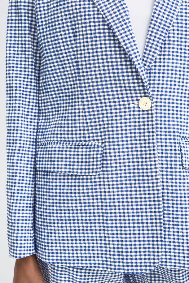 trendy women blazer 2026, classic lapel blazer women, women structured lightweight jacket, elevated everyday blazer, statement spring blazer women, blue plaid blazer women