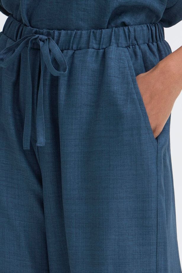 navy casual chic pants, navy travel outfit pants, navy textured trousers women, navy elevated everyday pants, navy loose fit trousers, navy lounge style wide leg pants