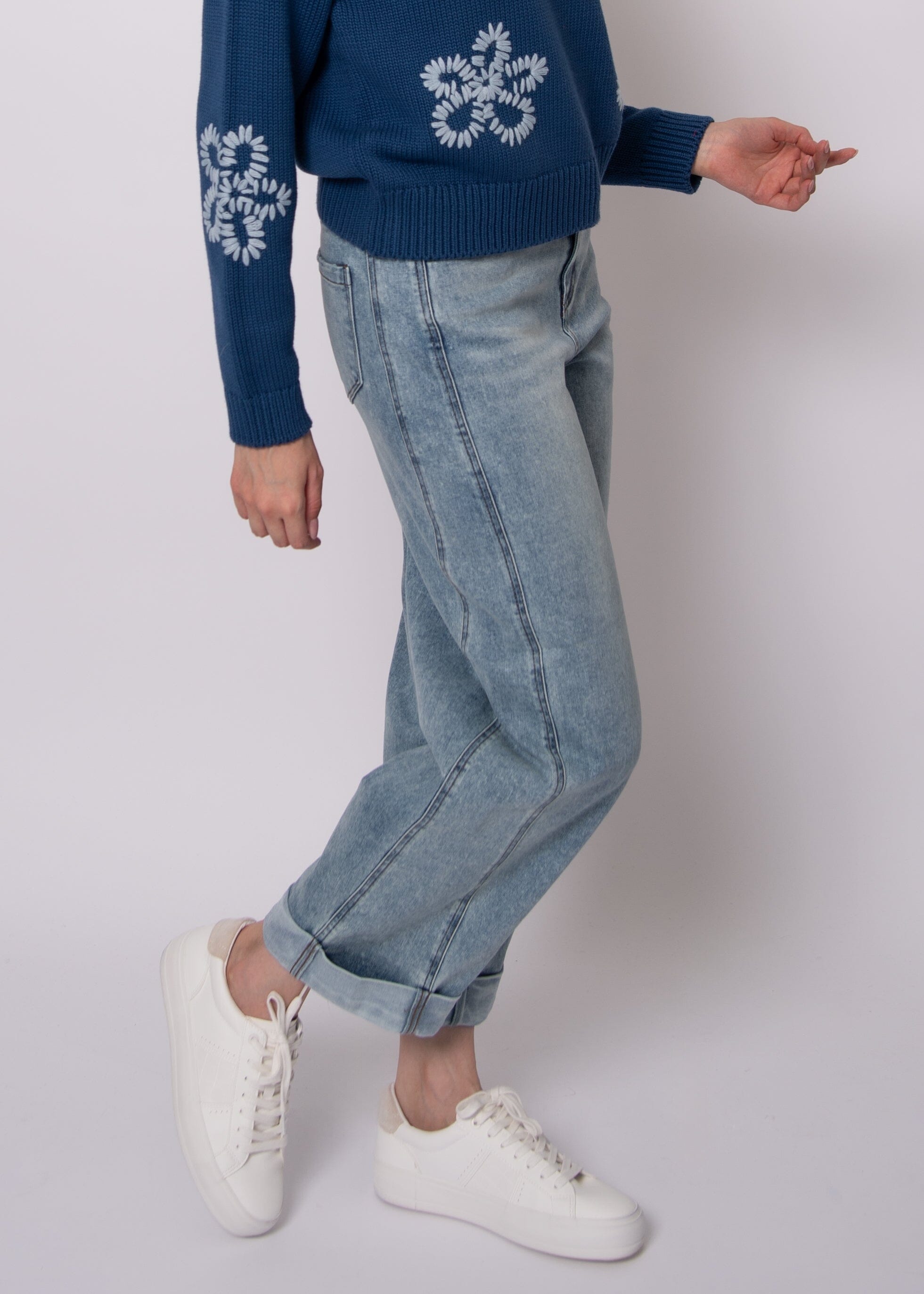 everyday barrel leg jeans, casual cuffed denim women, trendy light wash jeans, women barrel silhouette denim, minimalist denim outfit women, contemporary women jeans light wash