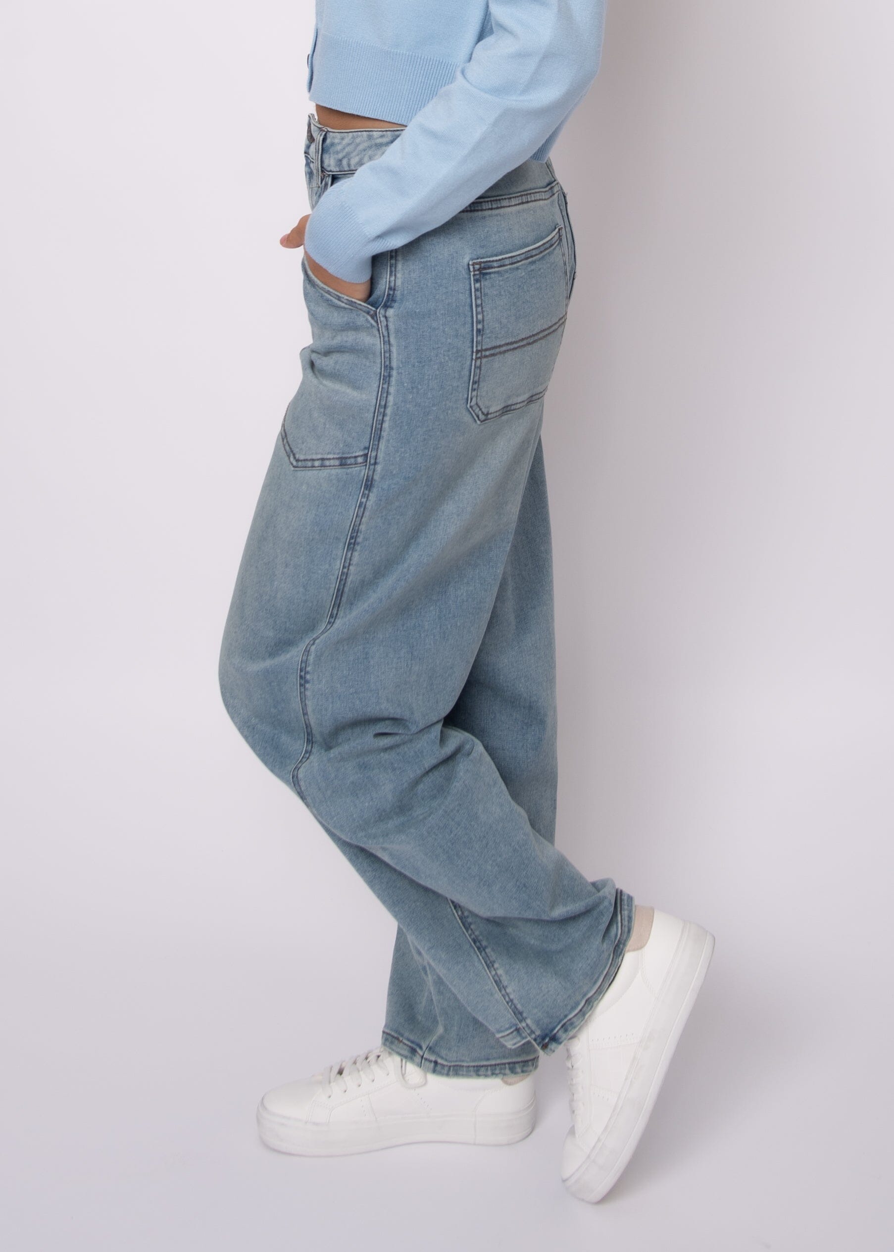 casual light wash barrel jeans, contemporary women denim style, comfortable barrel leg jeans