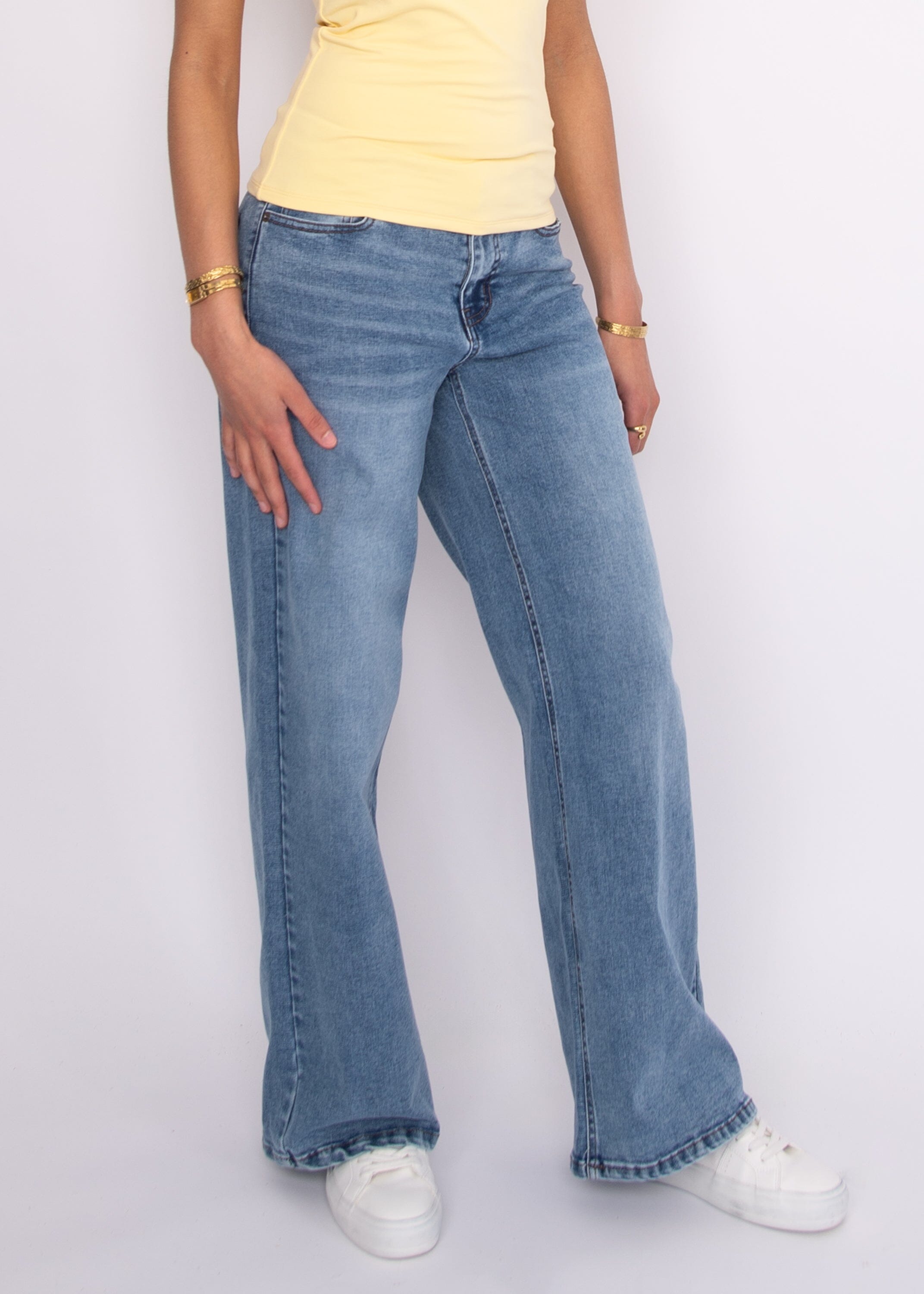 relaxed fit denim, classic blue jeans women, mid rise denim women, modern wide leg jeans, casual chic denim, versatile jeans women, womens fashion denim, light wash wide leg jeans,
