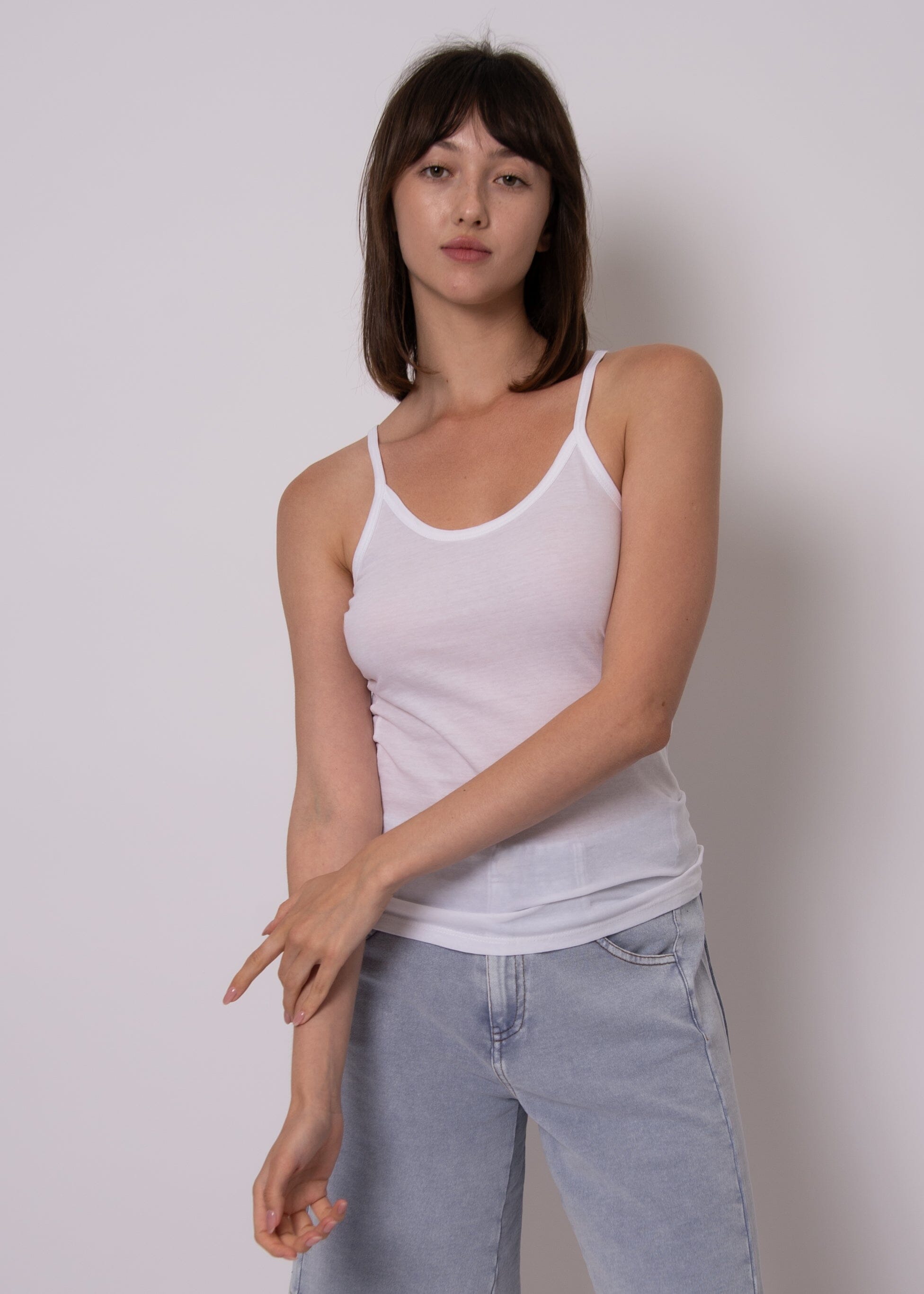 neutral capsule wardrobe top, white tank with thin straps, casual chic white tank