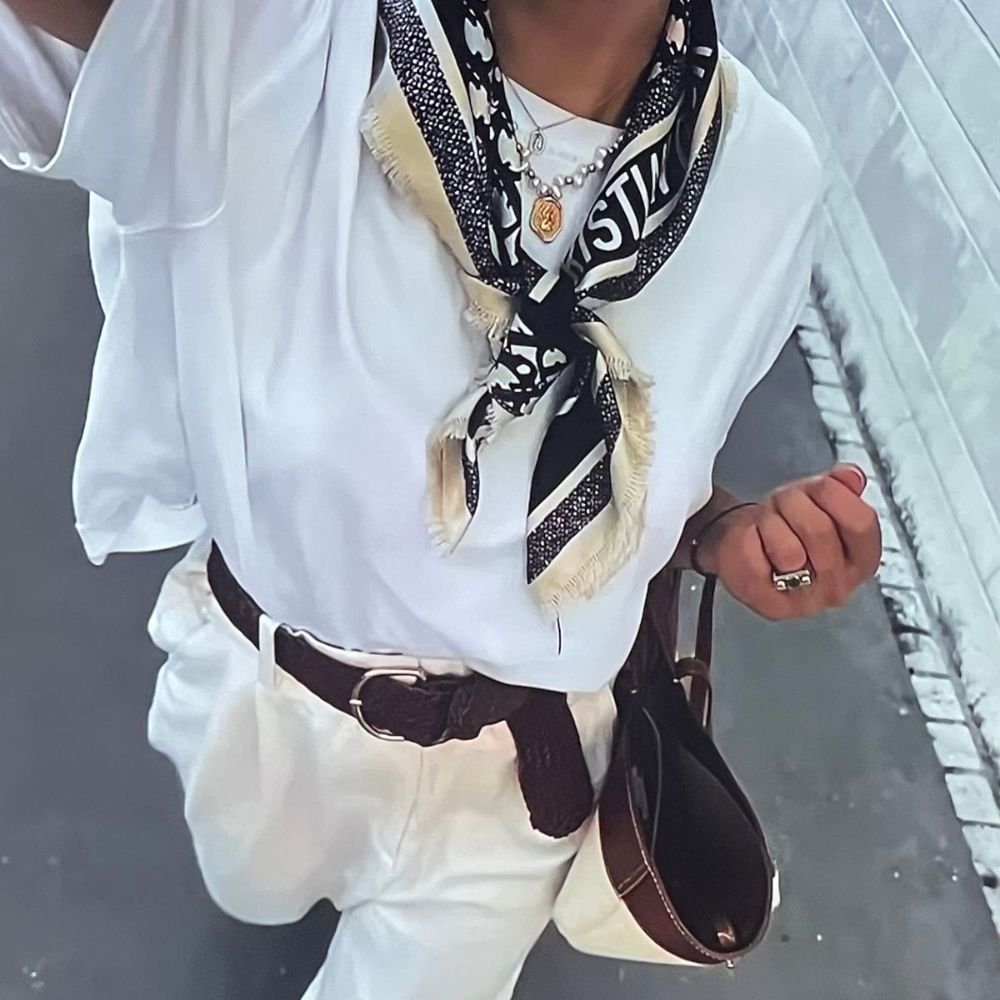 Learn how to style a silk scarf this spring. Easy outfit ideas including neck styling, hair styling, and everyday looks.