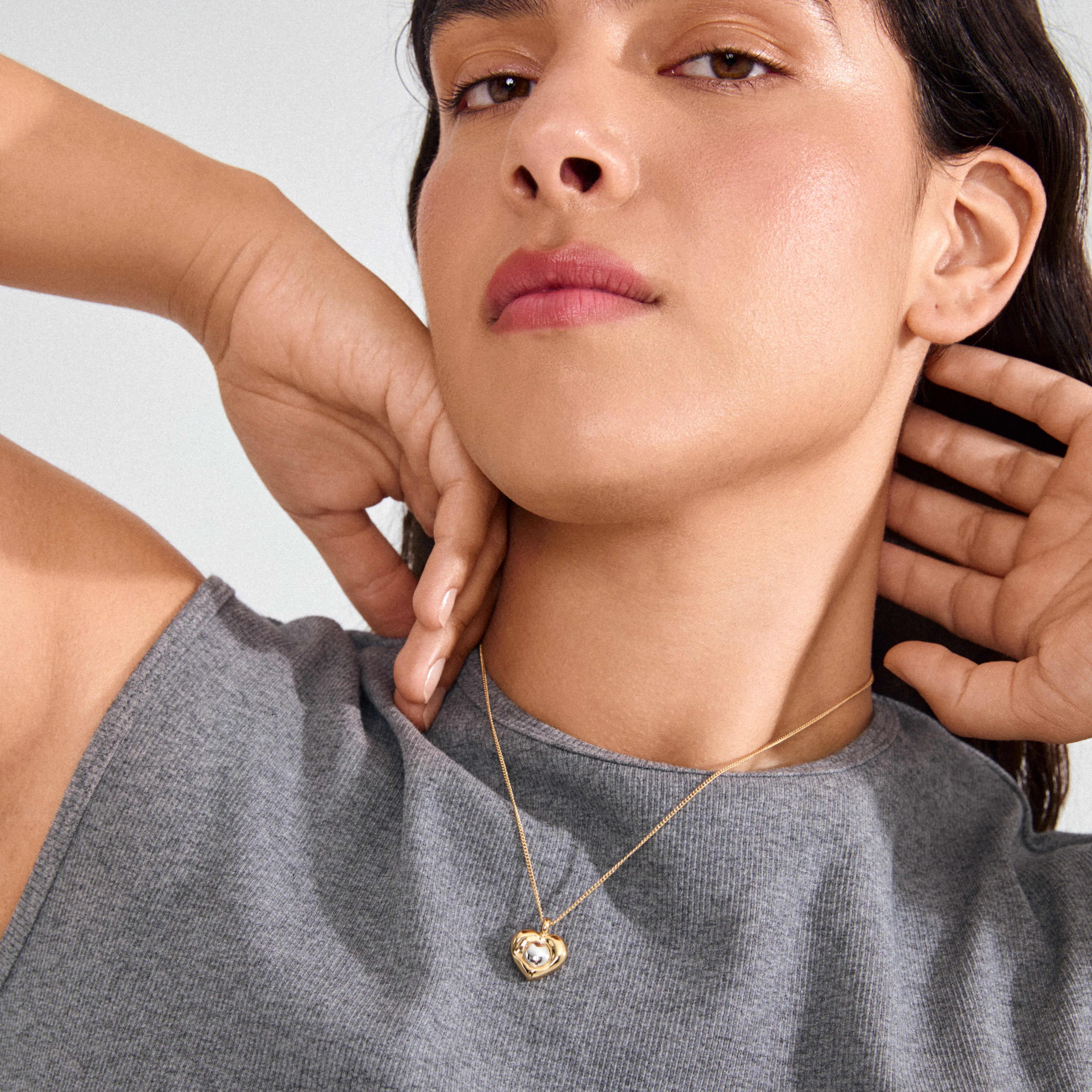 minimalist heart jewelry, dainty gold heart necklace, fashion jewelry for women, modern mixed metal jewelry, statement heart pendant