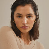 hunky gold earrings, modern gold jewelry, statement hoop earrings