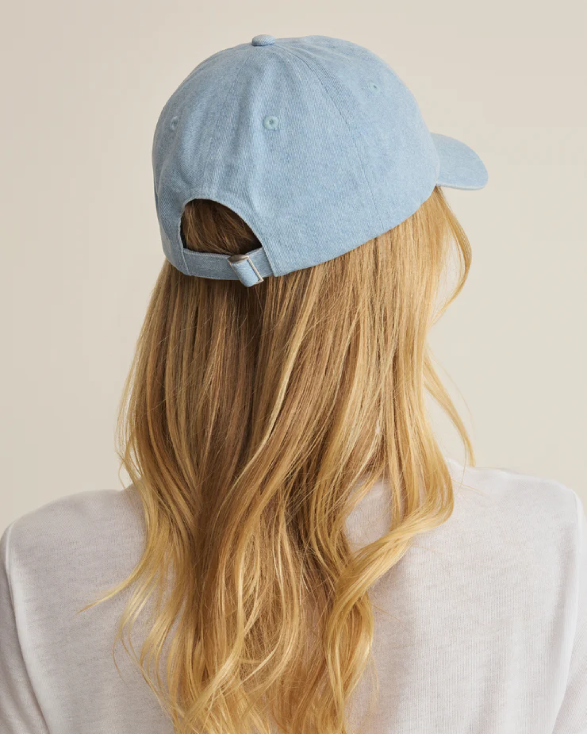 vacation outfit accessories, casual street style women, light blue denim cap, everyday baseball hat, summer casual accessories, trendy women’s cap, women’s denim accessories