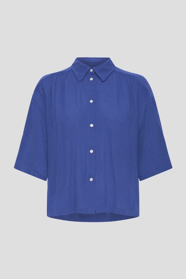 ICHI, navy button up blouse women, relaxed fit blouse navy, loose navy shirt women, lightweight navy button shirt, casual navy blouse outfit, soft drape blouse women navy, everyday navy top women, classic collar blouse navy, breathable navy button up women, oversized navy blouse style, casual chic navy shirt women