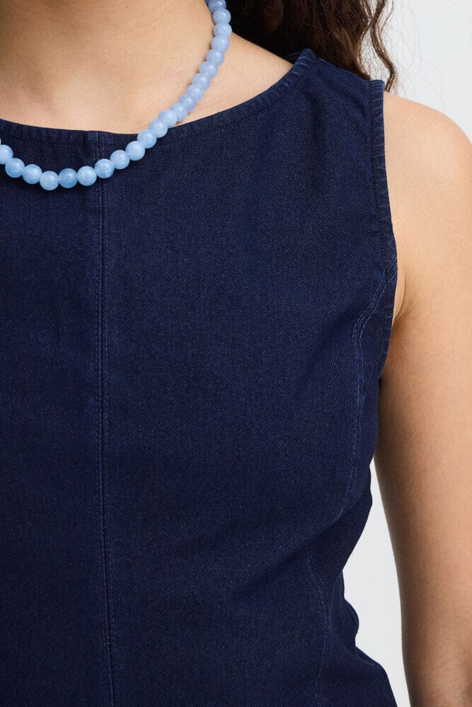 matching denim set women, minimalist denim top outfit, dark blue sleeveless top, everyday denim fashion women