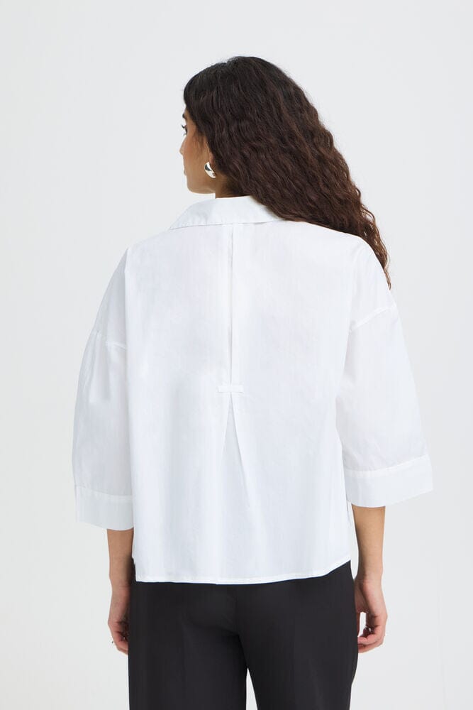 womens casual top white, loose fit button down, breathable cotton shirt women, contemporary shirt women, crisp white blouse, relaxed modern shirt