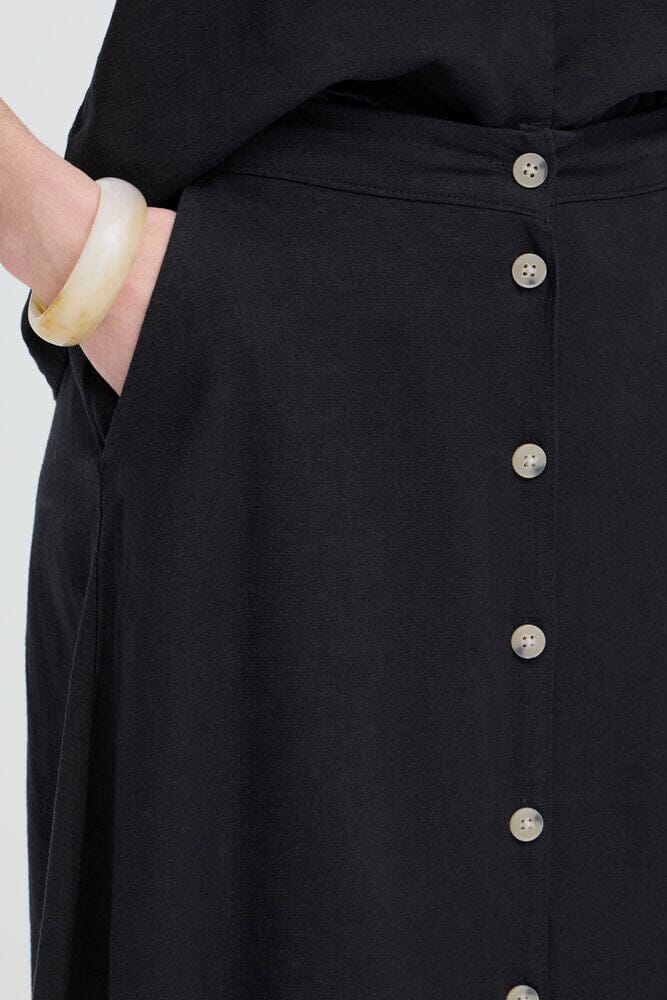 black skirt with buttons front, minimalist black skirt outfit, trendy linen midi skirt, versatile black skirt women