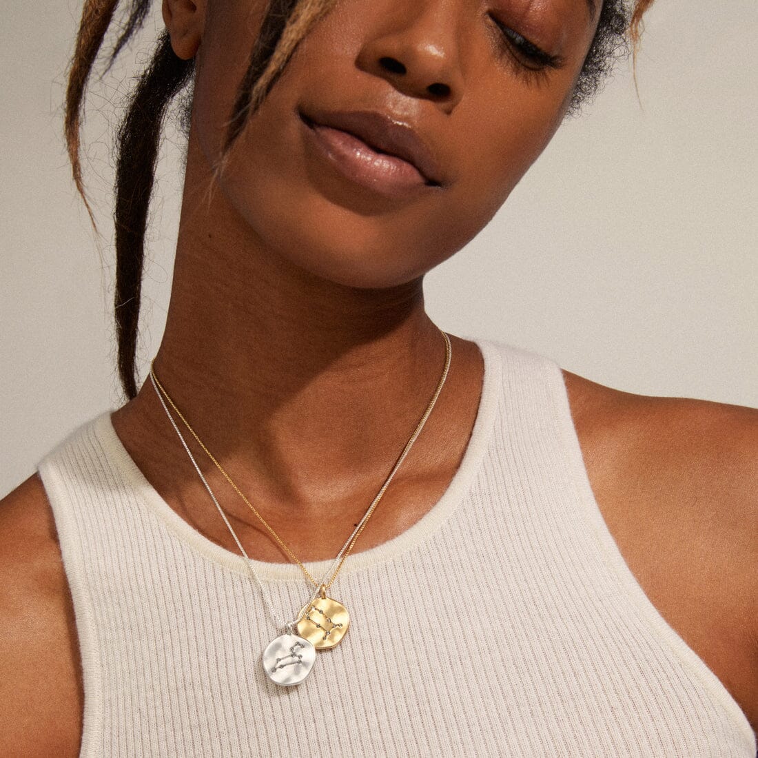 AQUARIUS. The eleventh sign of the zodiac. This coin necklace takes you on a journey all the way up to the stars with its stunning double-sided pendant that has a velvety, satin finish.
