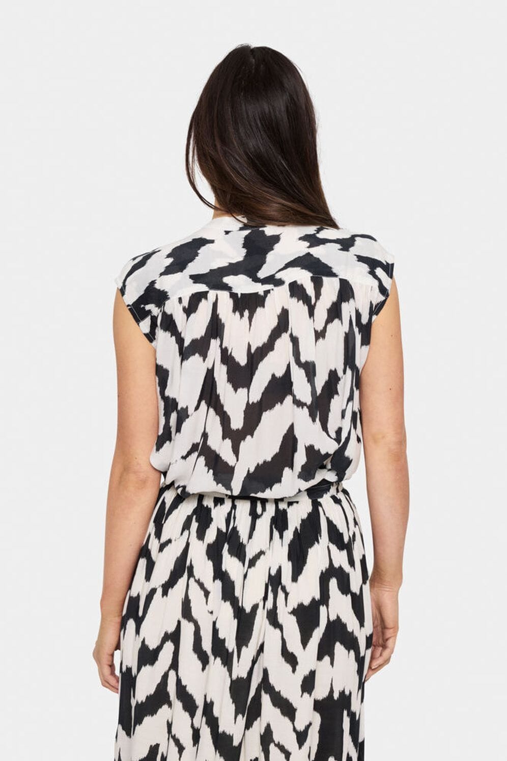 abstract print blouse, sleeveless top, lightweight blouse, statement print shirt, chic office blouse
