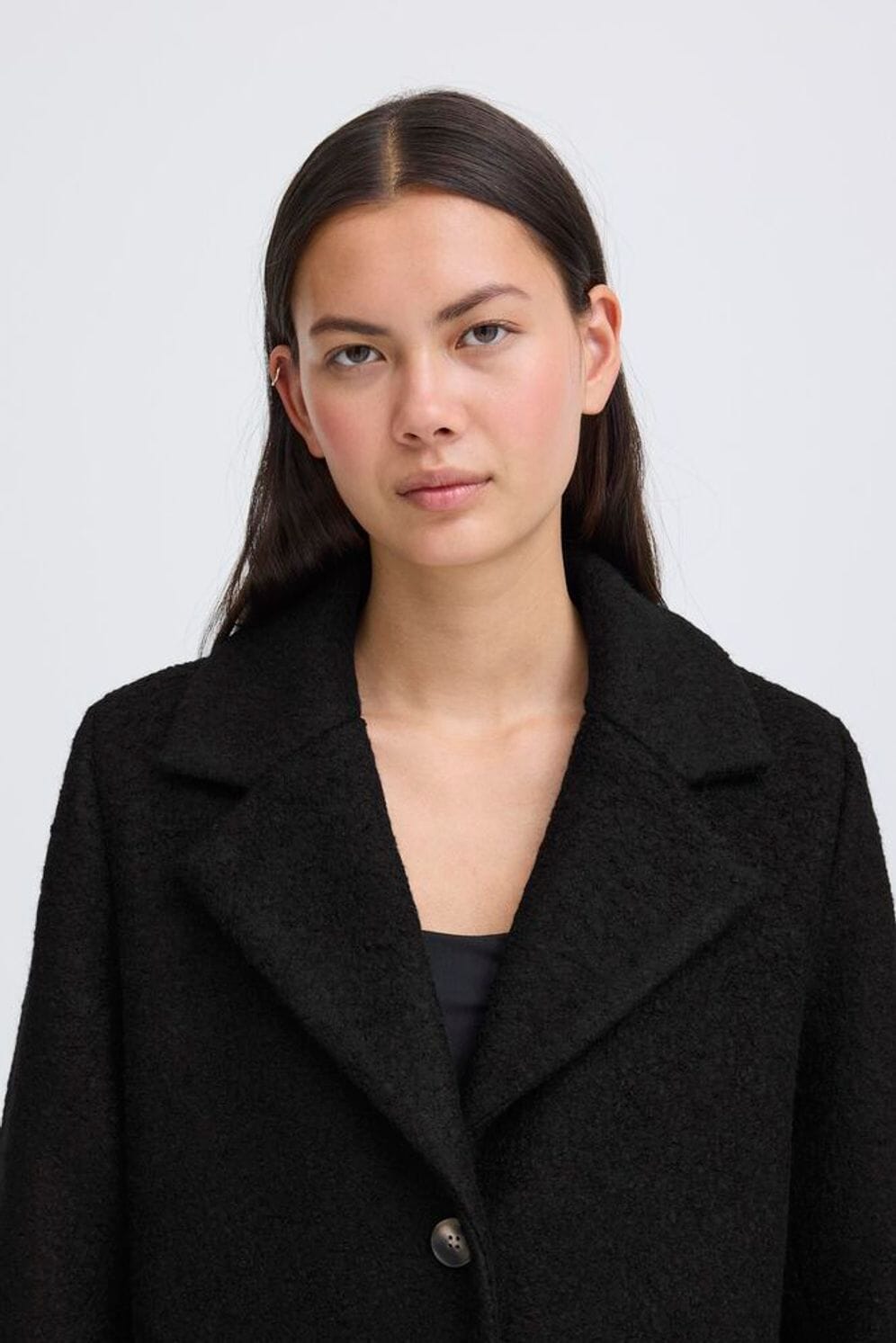 tailored black outerwear, structured wool layering piece