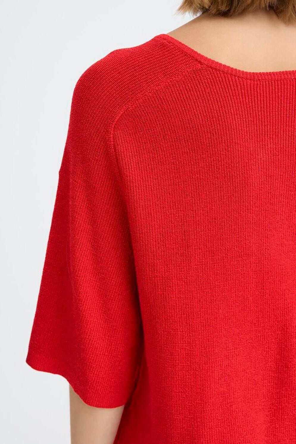red lightweight sweater, relaxed red pullover, vibrant knit tee, casual red blouse, bright knit short sleeve, statement red top