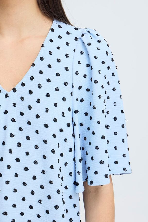 office ready blouse women, versatile summer top women, modern feminine blouse women, light blue top women, printed v neck top women