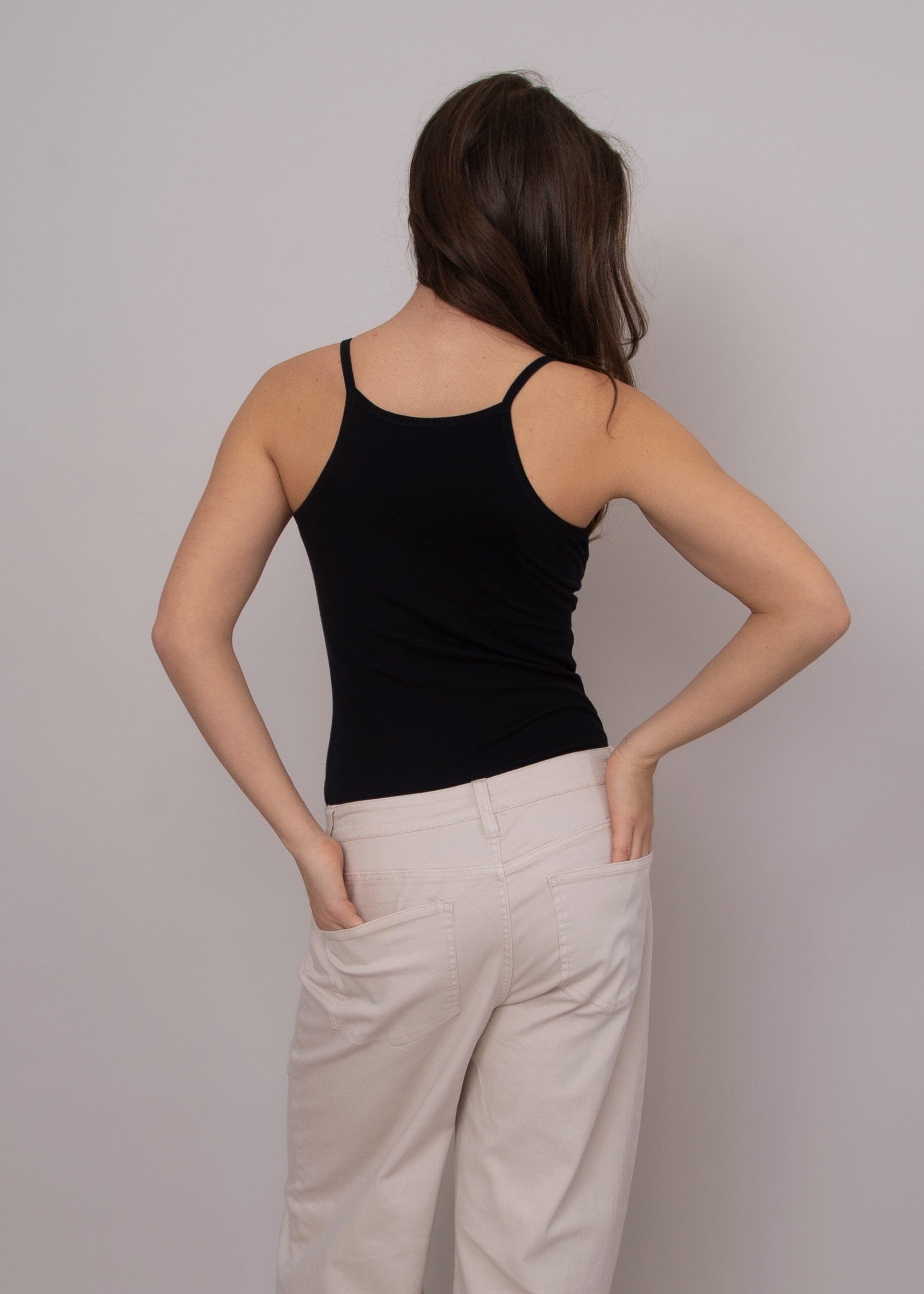 neutral capsule wardrobe top, black tank with thin straps, casual chic black tank