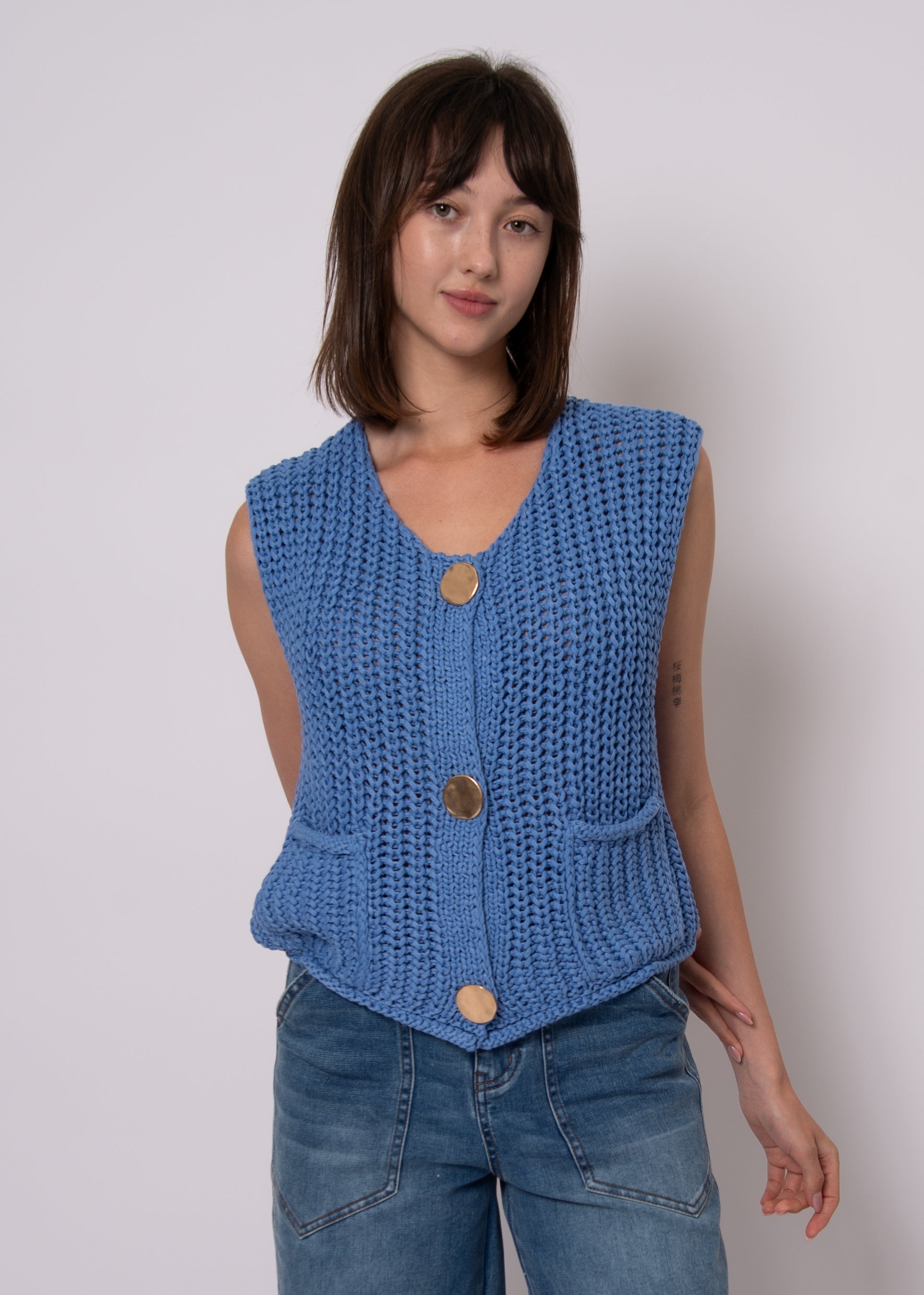 textured blue knit vest women styled with relaxed denim and modern silhouette